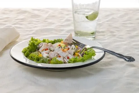 Ceviche, typical fish-based dish of Peruvian cuisine on white tablecloth. 스톡 사진