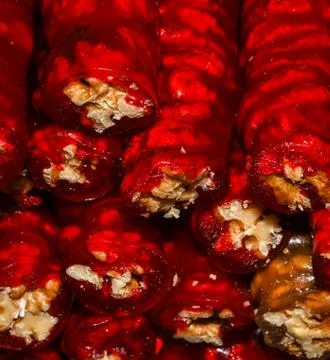 Cevizli sucuk made by dipping a string with walnuts into a grape molasses mix Stock Photos