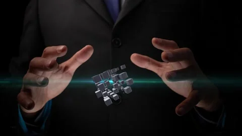 Cg footage of a new technological concept. A person holds a rotating cube in his Stock Footage 264645502
