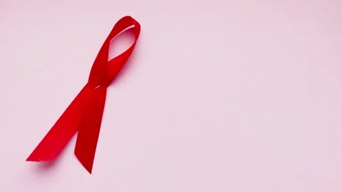 CGI Animation: Red ribbon commemorating "World Aids Day". 4K Footage Stock Footage 245592811
