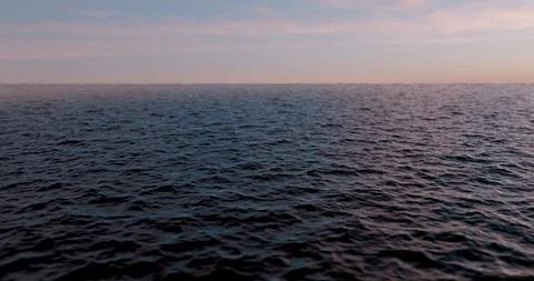 CGI of an ocean waves at evening. Seamless loop. Stock Footage
