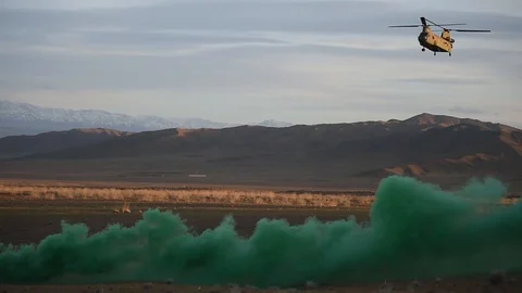 CH-47 Chinnok approaching green flare smoke in Afghanistan Stock-Footage 87205680
