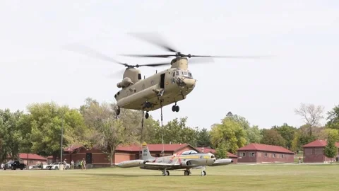 CH-47 Chinook hovering above F-80 'Shooting Star' during sling load operations Stock Footage 211806342