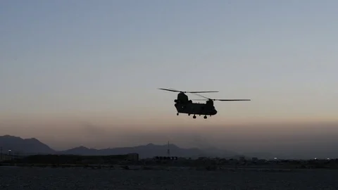 CH-47 Chinook taking off at dusk at Bagram Airfield, Afghanistan Stock Footage 98180286