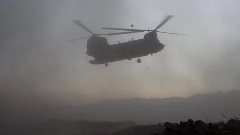 CH-47 creating dust storm while hovering at Bagram Airfield, Afghanistan Stock Footage 98180149