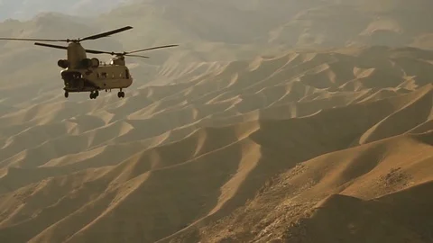 CH-47F Chinook helicopter fires self-defense flares Stock Footage 113343126