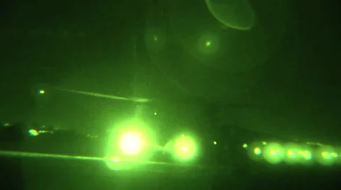 CH-47F Chinooks pick up sling loads at night Stock Footage 34100229
