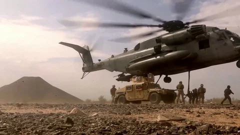 CH-53E Super Stallion helicopter about to lift a Humvee in the desert of Yuma Stock Footage 83466151