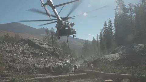 CH-53K King Stallion hovering above downed MH-60 Seahawk during recovery mission Stock Footage 254474768