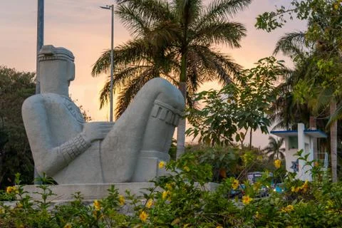 Chac Mool statue from the back against cloudy sky Stock Photos