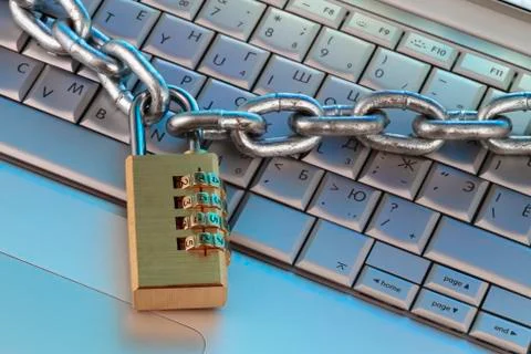 Chain and digital padlock on computer keyboard Stock Photos