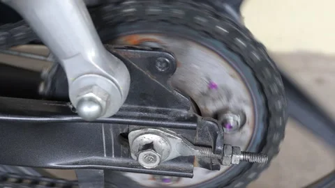 Chain and sprocket of motorcycle rear wheel is spinning with engine Stock Footage 151301853