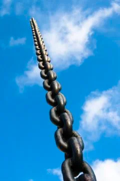 Chain on the background of blue sky Stock Photos