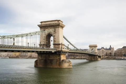 Chain Bridge with Danube river flowing under it as seen from riverside Stock Photos