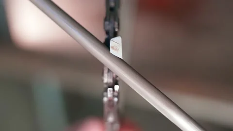 The chain of a chainsaw is sharpened with a round file close-up. Blunt saw teeth Stock Footage 210500522