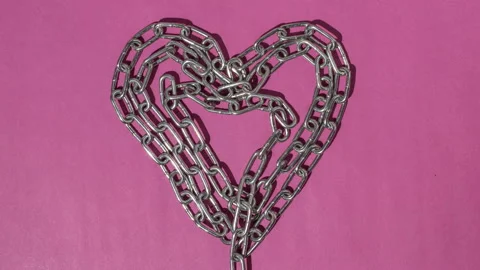 Chain heart, stopmotion. Pink background. Unchain my heart. Stock Footage 151394395