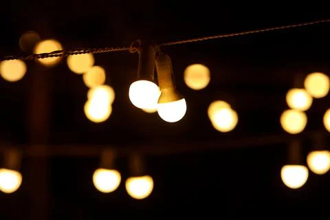 The chain of light bulbs at event. Stock Photos