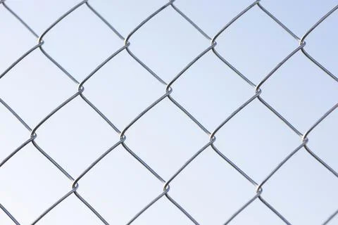 Chain link fence creating security barrier pattern Stock Photos
