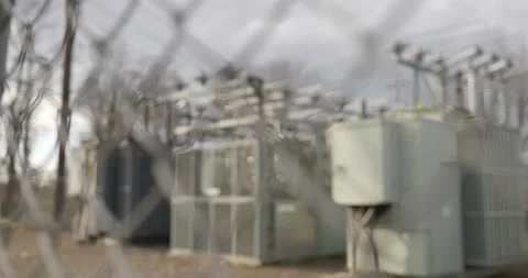Chain link fence rack focus to electric power station 動画素材 144064365