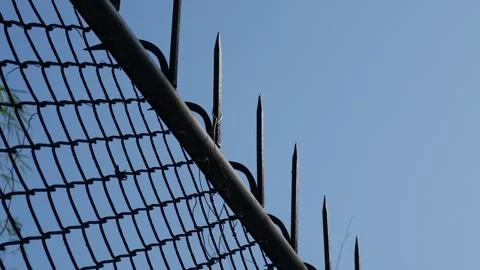 Chain Link Security Fence with Sharp Metal Spikes Stock Footage 327344212