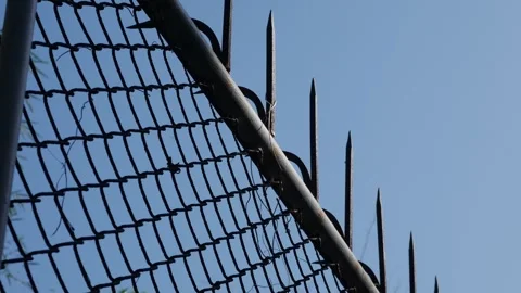 Chain Link Security Fence with Sharp Metal Spikes Stock Footage 328902278