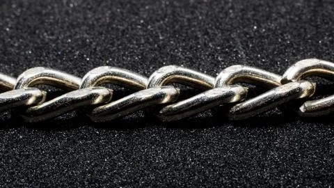 Chain links close up on black background Stock Photos