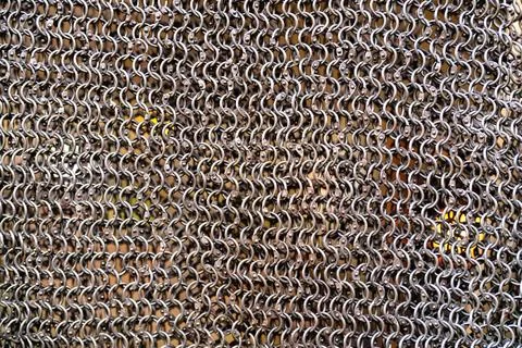 Chain mail close up texture background. abstract iron ring backdrop. protecti Stock Photos