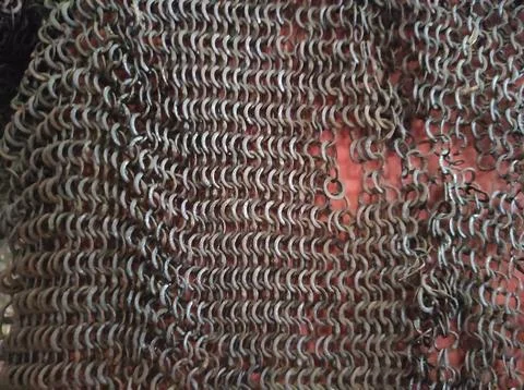 Chain mail texture. Old chain mail. Rusty texture of rings. Knights' clothi.. Stock Photos