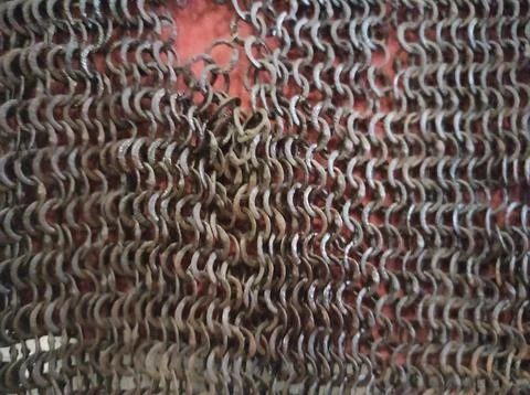 Chain mail texture. Old chain mail. Rusty texture of rings. Knights' clothi.. Stock Photos
