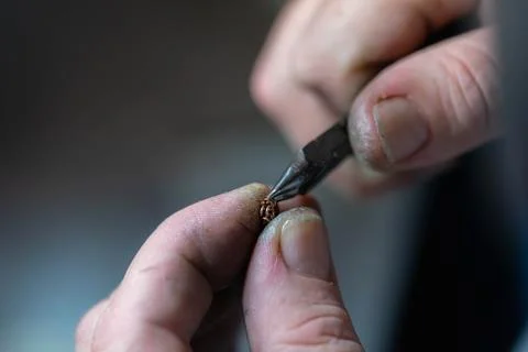 Chain making process. jewelry making. making a gold chain by a jeweler. repair Stock Photos