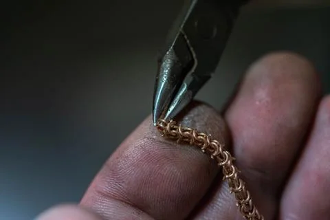 Chain making process. jewelry making. making a gold chain by a jeweler. repair Stock Photos
