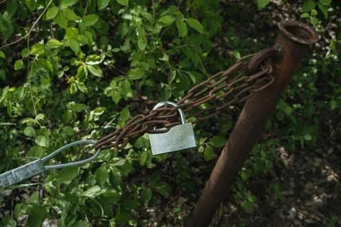 Chain with padlock blocking the passage Stock Photos