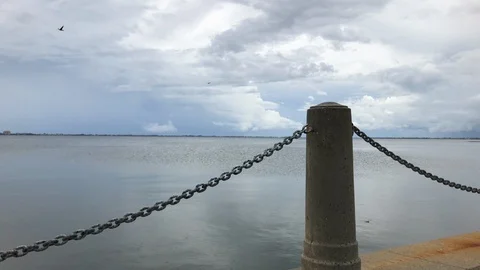 Chain rail and column looking out towards ocean Stock Footage 94769103
