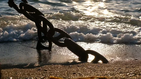 Chain in the sea waves on a sunny path. Stock Footage 232959746