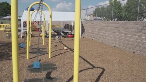 A chain swing for small children at a local kindergarten. Stock Footage 136447298