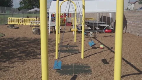 A chain swing for small children at a local kindergarten. Stock Footage 136447300