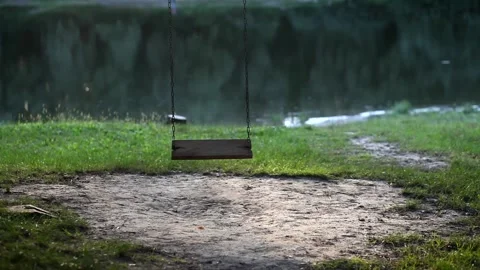 Chain swing on a tree by the river bank. Stock Footage 160289281