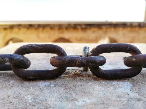 The chain on the wall. Stock Photos