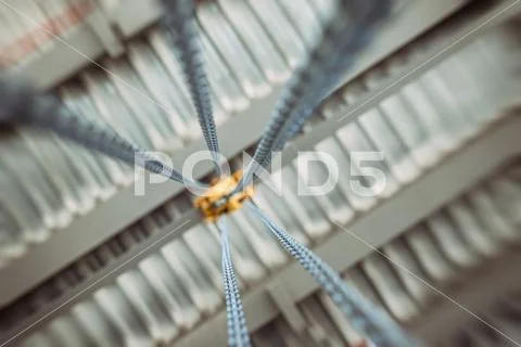 Chain winch for lifting loads inside shop premises at plant Stock Photos