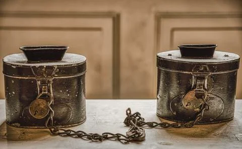 Chained, old fashioned offer boxes in Vartov Kirke bear mercy and charity image Stock Photos