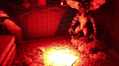 Chained winged monster inside a cage creates dark fantasy horror atmosphere for  Video stock 346305184