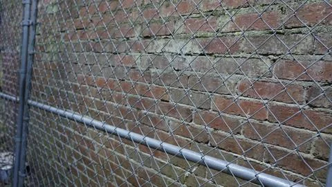 Chainlink Fence and Brick Stock Photos
