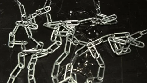 Chains and handcuffs Stock Footage 134460298