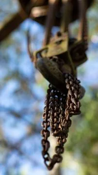 Chains attached to a hook and blurred background, away from the workplace. Stock Photos