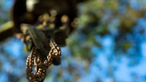 Chains attached to a hook and blurred background, away from the workplace. Stock Photos