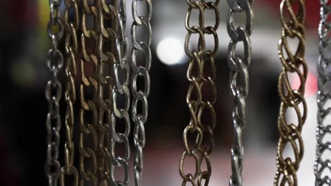 Chains of different matals hanging on market. Stock Footage 305370933