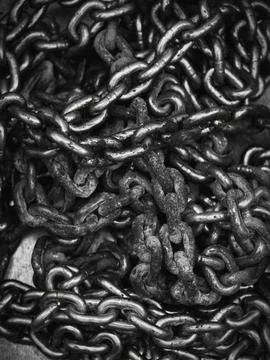 Chains in an industrial or construction setting with a close-up perspective.. 스톡 사진