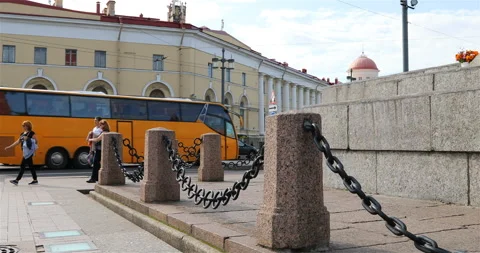 Chains sag to asphalt in the town square Stock Footage 101660832