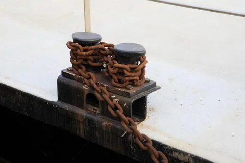 Chains securing ships to the pier Stock Photos