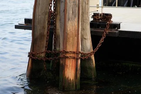 Chains securing ships to the pier Stock Photos